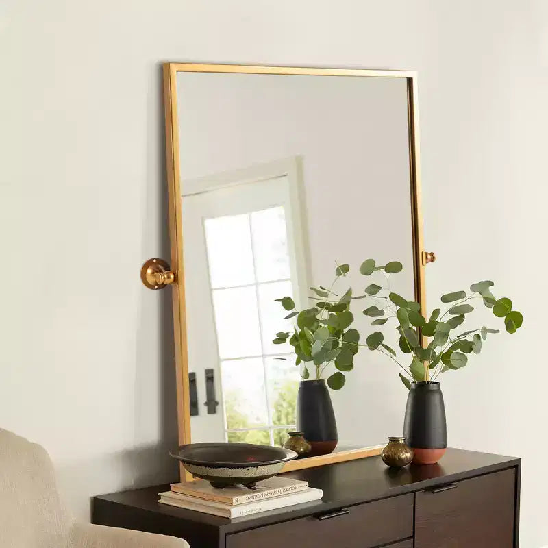 Specchio per bagno girevole con cornice in metallo